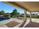 Beautiful backyard pool view from the covered patio and desert landscaping at 3531 E Norwood Cir, Mesa, AZ 85213