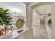 Stylish entryway with travertine floors, decorative accents, and a view into the living area at 3531 E Norwood Cir, Mesa, AZ 85213