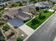 Aerial shot of a well-manicured front yard with a lush green lawn and mature trees at 3531 E Norwood Cir, Mesa, AZ 85213