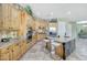 Well-appointed kitchen with custom cabinets, stainless appliances, and a large island at 3531 E Norwood Cir, Mesa, AZ 85213