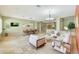 Spacious living area with travertine floors, comfortable seating, and an open layout at 3531 E Norwood Cir, Mesa, AZ 85213