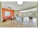 Inviting living space with travertine floors, comfortable seating, and a seamless flow to the dining area at 3531 E Norwood Cir, Mesa, AZ 85213