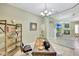 Home office featuring a wooden desk, decorative lamp, and comfortable chair at 3531 E Norwood Cir, Mesa, AZ 85213