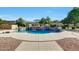 Beautiful backyard pool with lush landscaping and elegant water features at 3531 E Norwood Cir, Mesa, AZ 85213