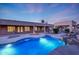Backyard oasis with a modern pool design, complemented by covered seating areas for ultimate outdoor relaxation and entertainment at 3531 E Norwood Cir, Mesa, AZ 85213