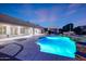 Sparkling pool with rock water feature offers a serene escape to this backyard oasis at 3531 E Norwood Cir, Mesa, AZ 85213