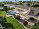 Aerial view of a backyard pool and spa with a covered patio and lush landscaping at 3531 E Norwood Cir, Mesa, AZ 85213