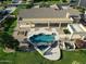 Aerial view showcasing a beautiful backyard pool with a spa, patio, and desert landscaping at 3531 E Norwood Cir, Mesa, AZ 85213