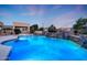 Backyard pool featuring a custom waterfall feature and lush desert landscaping at 3531 E Norwood Cir, Mesa, AZ 85213