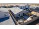Backyard aerial view reveals a patio, trampoline, and a fenced-in area, perfect for outdoor recreation and relaxation at 36284 W San Clemente Ave, Maricopa, AZ 85138