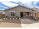 Backyard view with patio, manicured gravel, and string lights for evening entertainment at 36284 W San Clemente Ave, Maricopa, AZ 85138