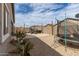Backyard with patio, seating, a BBQ grill, string lights, and a trampoline at 36284 W San Clemente Ave, Maricopa, AZ 85138