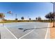 A community basketball court featuring well-maintained hoops, painted lines, and ample space for sports and recreation at 36284 W San Clemente Ave, Maricopa, AZ 85138