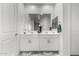Bright bathroom features double sinks with stylish mirrors and cabinets at 36284 W San Clemente Ave, Maricopa, AZ 85138