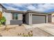 Charming single-story home with a two-car garage, desert landscaping, and a welcoming front entrance at 36284 W San Clemente Ave, Maricopa, AZ 85138