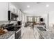Bright kitchen showcases granite countertops, stainless steel appliances, and an open floor plan at 36284 W San Clemente Ave, Maricopa, AZ 85138