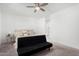 Cozy main bedroom features a ceiling fan and an attached bathroom at 36284 W San Clemente Ave, Maricopa, AZ 85138