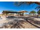 A community playground with picnic tables and recreational facilities in a spacious area, perfect for families and gatherings at 36284 W San Clemente Ave, Maricopa, AZ 85138