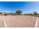 Community recreation area with a volleyball net, picnic area, and playground at 36284 W San Clemente Ave, Maricopa, AZ 85138