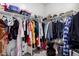 Spacious walk-in closet with ample hanging space and built-in shelving for organized storage of clothing and accessories at 36284 W San Clemente Ave, Maricopa, AZ 85138