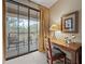 Desk and chair with views of the desert landscape, plus outdoor seating on the private balcony at 36601 N Mule Train Rd # 40A, Carefree, AZ 85377