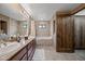 Bathroom with a double vanity, lots of storage, shower and bathtub with neutral color tiling at 36601 N Mule Train Rd # 40A, Carefree, AZ 85377