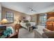 Bedroom featuring a ceiling fan, a comfortable bed with side tables, and a sliding door to a patio at 36601 N Mule Train Rd # 40A, Carefree, AZ 85377