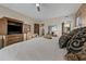 Bedroom featuring a ceiling fan, a comfortable bed with decorative pillows, a TV, and a large wardrobe at 36601 N Mule Train Rd # 40A, Carefree, AZ 85377