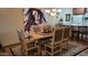 The dining room is open to the kitchen with views of artwork, a dining table, and seating at 36601 N Mule Train Rd # 40A, Carefree, AZ 85377