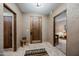 Welcoming foyer with a solid wood door, neutral tones and stylish decor at 36601 N Mule Train Rd # 40A, Carefree, AZ 85377