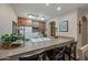 Efficient kitchen features a breakfast bar, wood cabinetry, and sleek appliances at 36601 N Mule Train Rd # 40A, Carefree, AZ 85377