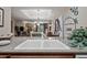 A kitchen sink overlooking the living room with granite countertops and pendant lighting at 36601 N Mule Train Rd # 40A, Carefree, AZ 85377