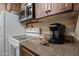 The kitchen features modern appliances, cabinetry, and a coffeemaker at 36601 N Mule Train Rd # 40A, Carefree, AZ 85377