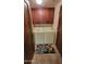 The laundry room has a washer, dryer, cabinets, a door, and a rug on a tiled floor at 36601 N Mule Train Rd # 40A, Carefree, AZ 85377