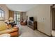 Bright living room featuring leather seating and a view to the outdoor space at 36601 N Mule Train Rd # 40A, Carefree, AZ 85377