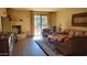 Living room featuring a fireplace and a sliding glass door leading to the backyard at 36601 N Mule Train Rd # 40A, Carefree, AZ 85377