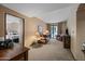 Cozy living room with comfortable leather seating and access to an outdoor space at 36601 N Mule Train Rd # 40A, Carefree, AZ 85377
