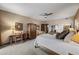 Spacious bedroom featuring a ceiling fan, closet, and furniture at 36601 N Mule Train Rd # 40A, Carefree, AZ 85377