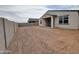 Spacious backyard featuring block wall and covered patio, providing ample room for activities at 37342 W San Clemente St, Maricopa, AZ 85138