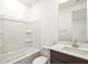 Modern bathroom featuring a tub and shower combination, white toilet, and a vanity at 37342 W San Clemente St, Maricopa, AZ 85138