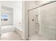 Bright bathroom featuring a bathtub and a separate glass-enclosed shower, offering a clean and modern design at 37342 W San Clemente St, Maricopa, AZ 85138