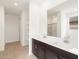 Bathroom featuring double sinks, a large mirror, and ample counter space for comfortable use at 37342 W San Clemente St, Maricopa, AZ 85138