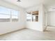 Bright bedroom with wood-look flooring and lots of natural light from the large windows at 37342 W San Clemente St, Maricopa, AZ 85138