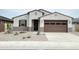 Charming single-story home featuring a well-maintained yard and a two-car garage at 37342 W San Clemente St, Maricopa, AZ 85138