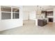 Well-lit kitchen with an island, granite countertops, and stainless steel appliances at 37342 W San Clemente St, Maricopa, AZ 85138