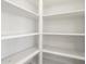 Organized white pantry with ample shelving for storage at 37342 W San Clemente St, Maricopa, AZ 85138
