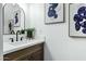 Bathroom with a white sink, wood cabinets, and elegant decor at 4142 N 11Th St # 10, Phoenix, AZ 85014