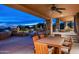 Spacious back patio with desert landscaping and an outdoor grill at 41688 N 111Th Pl, Scottsdale, AZ 85262