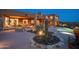 Desert landscaping surrounds the pool and backyard area with a fire pit at 41688 N 111Th Pl, Scottsdale, AZ 85262