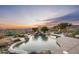 Beautiful backyard showcasing a freeform pool with desert landscaping, and comfortable patio seating at 41688 N 111Th Pl, Scottsdale, AZ 85262